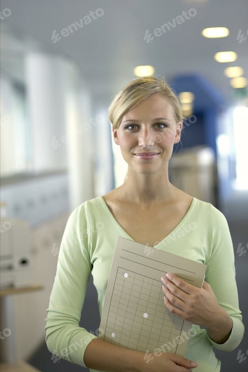 Preview: Portrait, Businesswoman Holding A File Folder
