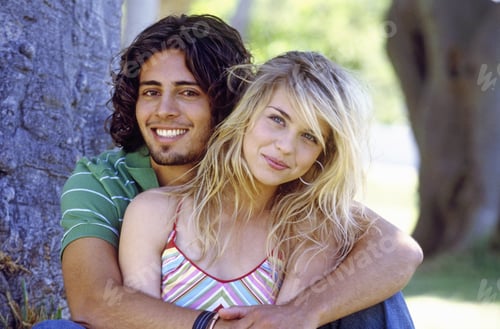 Preview: Portrait Of A Young Couple Embracing In A Park
