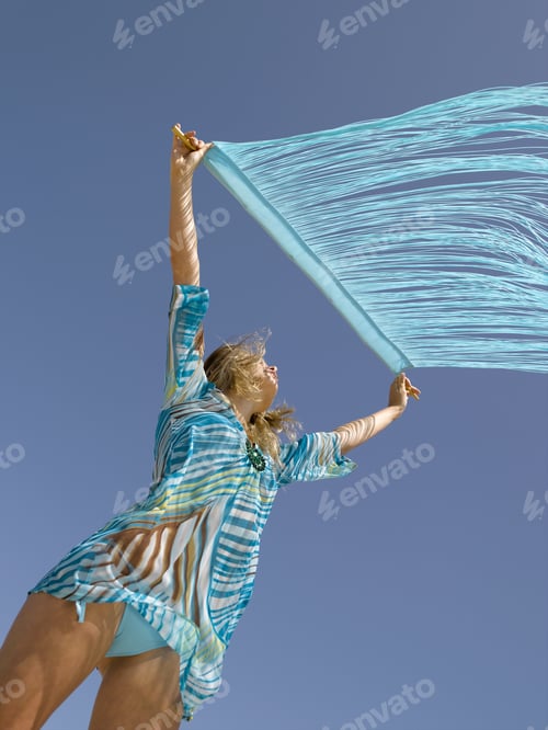 Preview: Woman Holding Fringe Over Head In Wind