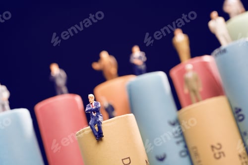Preview: Rolls Of Assorted Euro Coins With Businessmen Figurines