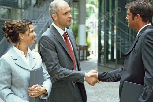 Preview: Two Businessmen Shaking Hands On A Deal