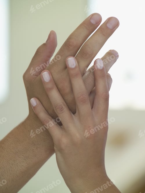 Preview: Close Up Of Couple’S Hands Touching