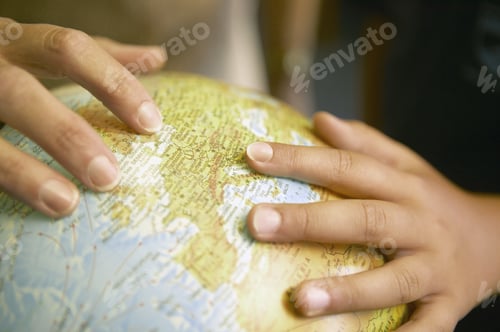 Preview: View Of Hands On A Globe