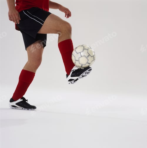 Preview: Close-Up Of Feet Of Soccer Player Balancing The Ball