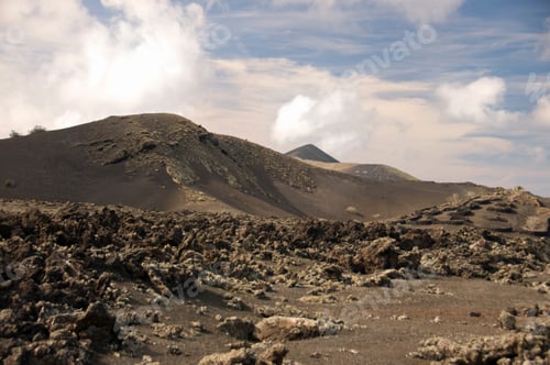Preview: Barren Landscape Under Cloudy Blue Sky