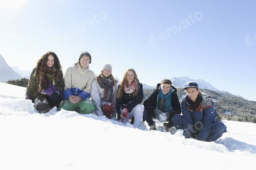Preview: Portrait Of Young Friends Crouching On Snow