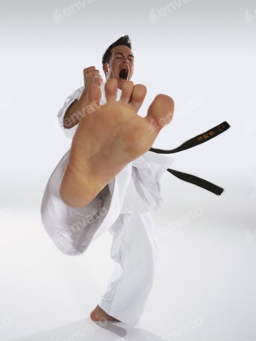 Preview: Close-Up Of Foot As Man Karate-Kicks Towards The Camera