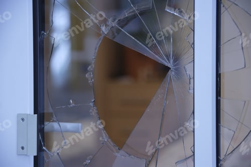 Preview: Close Up Of Broken Glass In Window