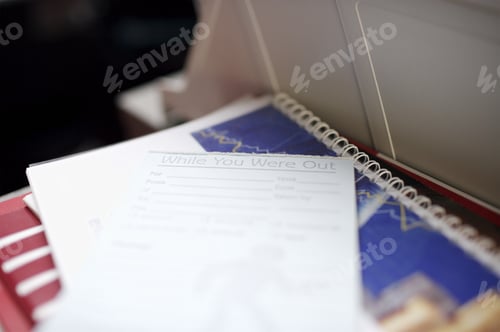 Preview: Close Up Of Notebook And Papers On Desk