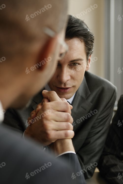Preview: View Of Two Businessmen Arm Wrestling