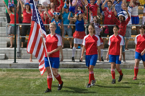 Preview: Group Of Female Soccer Players With American Flag Walking On Field