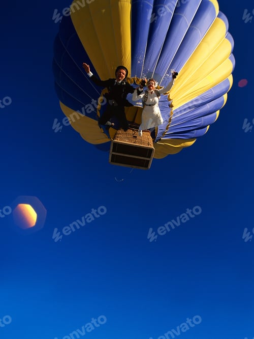 Preview: Underview Of Skydiving Couple Jumping From A Hot-Air Balloon