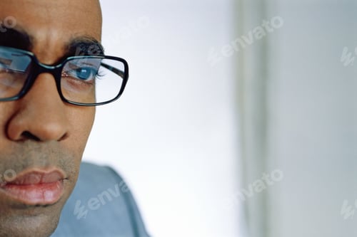 Preview: View Of Man With Glasses Concentrating