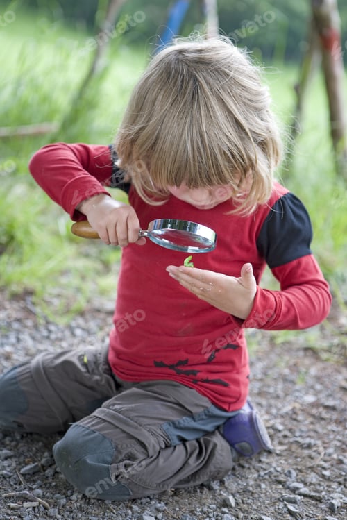 Preview: Kindergarten Kids With Magnifying Glass In A Wood Kindergarten