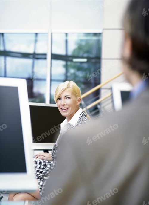 Preview: Portrait Of A Young Businesswoman Working In Office Setting With Young Businessman'S Shoulder In