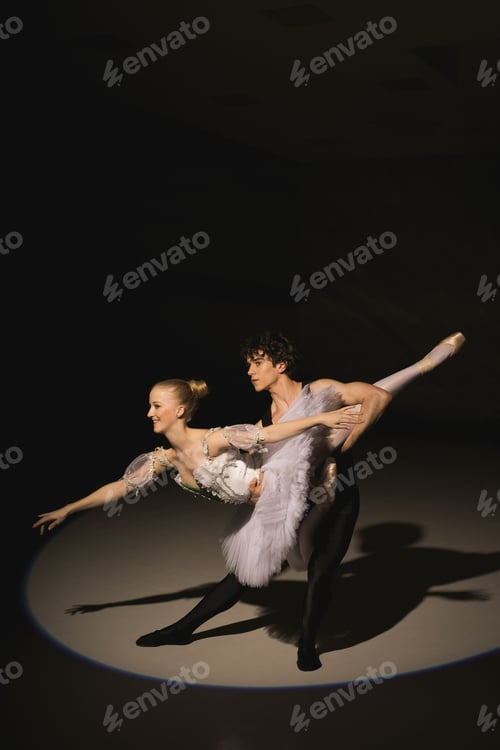 Preview: Male And Female Ballet Dancers Dancing On Stage In The Spotlight