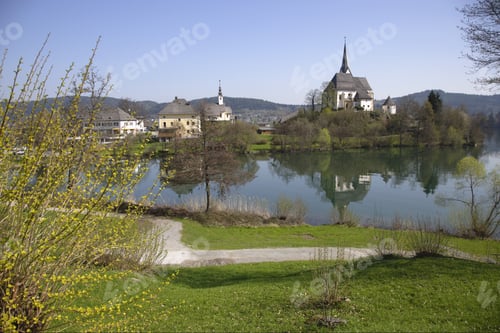 Preview: Scenic View Of Church On On Edge Of Water, Carinthia, Austria