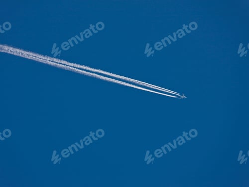 Preview: Airplane Flying Against Blue Sky