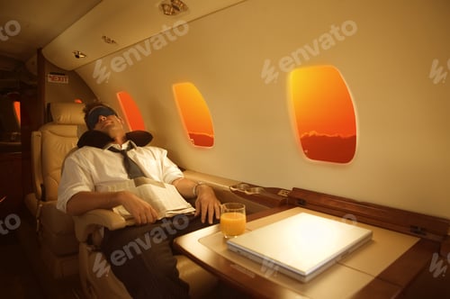 Preview: Businessman Sleeping With Sleep Mask On Airplane