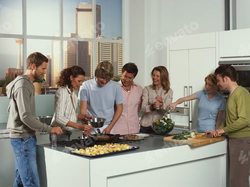 Preview: Group Of Friends Cooking In Kitchen