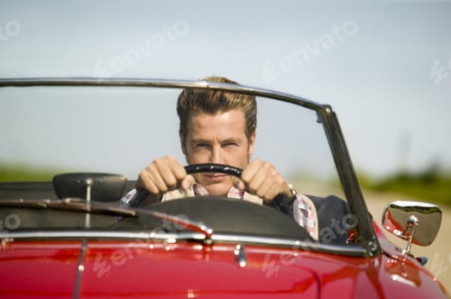 Preview: Man Driving Convertible In Countryside