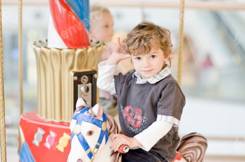 Preview: Portrait Of Young Boy On Carousel