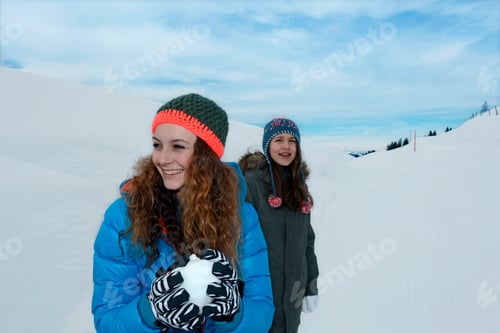 Preview: Teenage Girls With Snowball On Skiing Holiday, Tirol, Austria, Europe