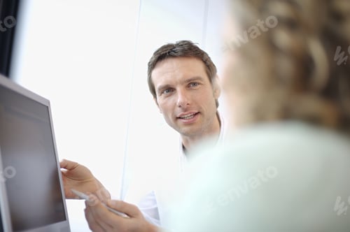 Preview: Male Doctor Talking To Patient