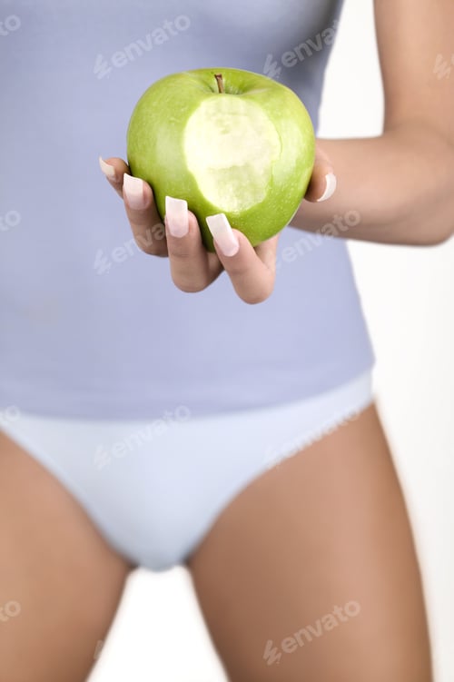 Preview: Close Up Of Woman In Underwear Holding Apple With Bite In It