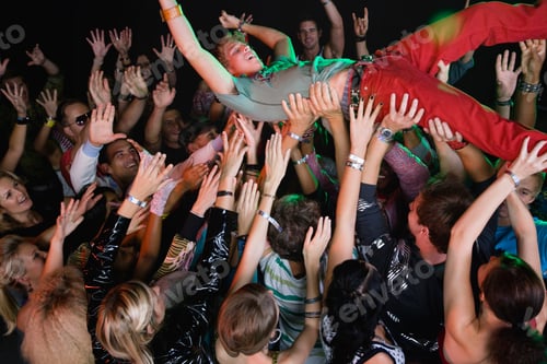 Preview: Performer Body Surfing Across Audience At Concert