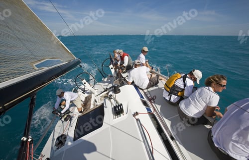 Preview: High Angle View Of Group Sitting On Edge Of Sailboat In Key West, Florida, Usa