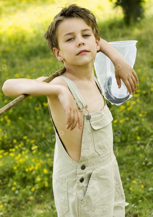 Preview: Young Boy Holding Net With Fish Outdoors