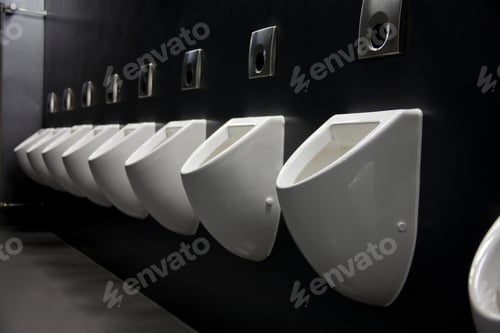 Preview: A Line Of Urinals In A Public Toilet
