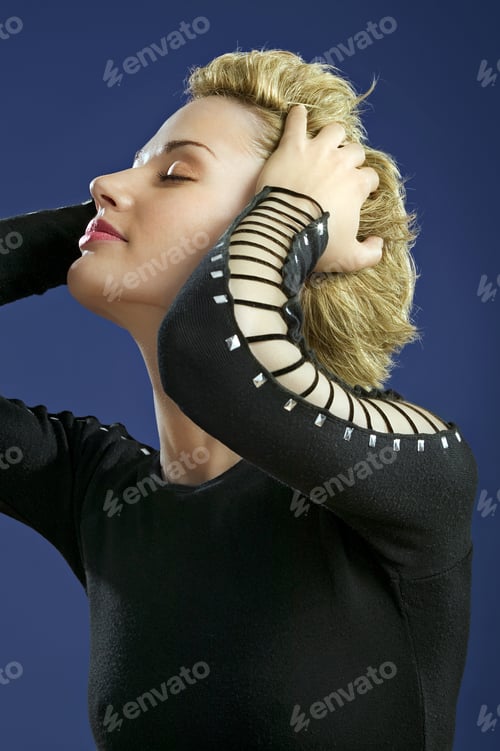 Preview: Studio Shot Of Woman With Hands In Hair