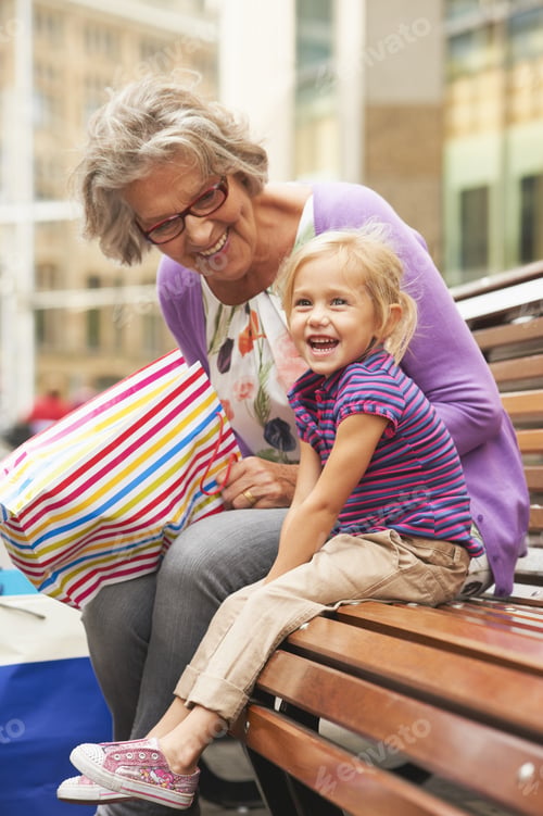 Preview: Senior Woman With Granddaughter On Park Bench