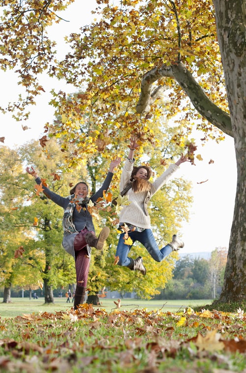 Preview: Teenage Girls Jumping In Park