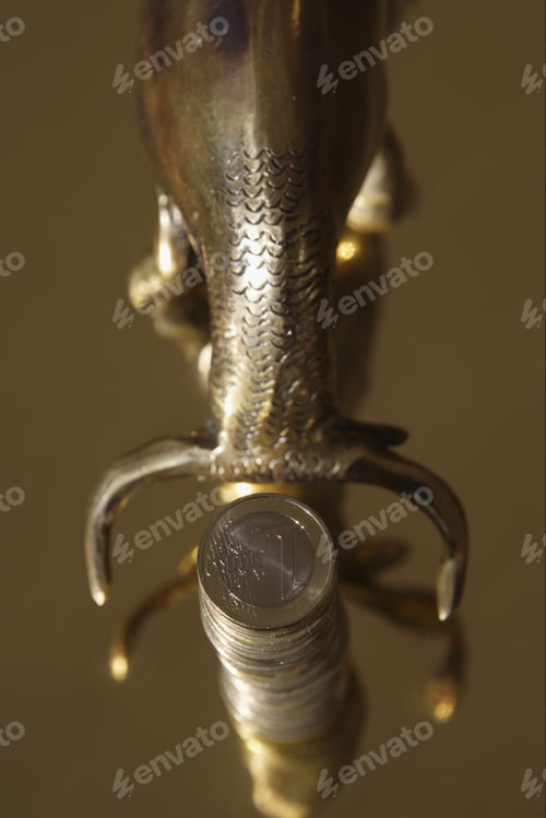 Preview: Stack Of One Euro Coins Next To Bull Figurine