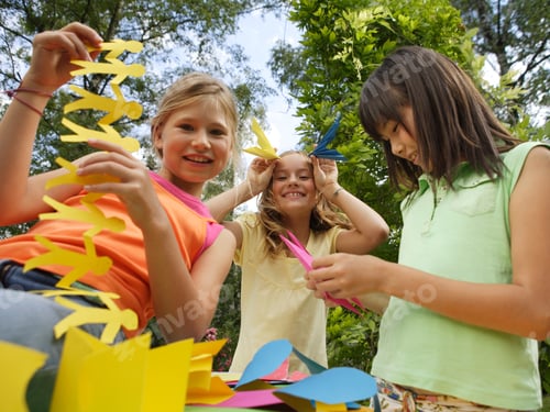 Preview: Young Girls Making Paper Cut-Outs