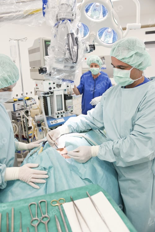 Preview: Doctor Operating On Patient In Operating Room