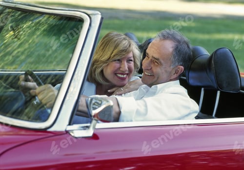 Preview: Middle-Aged Couple Smiling And Driving