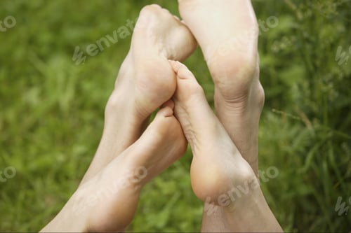 Preview: Close Up Of Couple'S Bare Feet In Grass