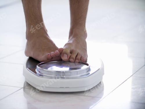 Preview: Close Up Of Man Standing On Scale