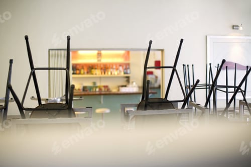 Preview: View Of Stacked Chairs In Classroom