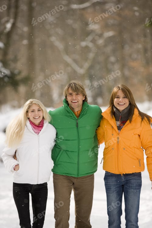 Preview: Man And Two Women Walking In The Snow