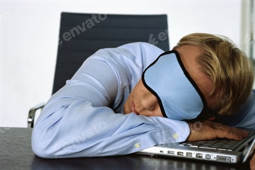 Preview: View Of Businessman Sleeping On Laptop