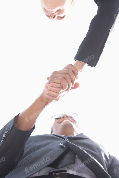 Preview: Low Angle View Of Businesspeople Shaking Hands