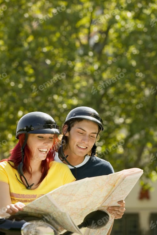 Preview: Couple On Scooter Looking At Map