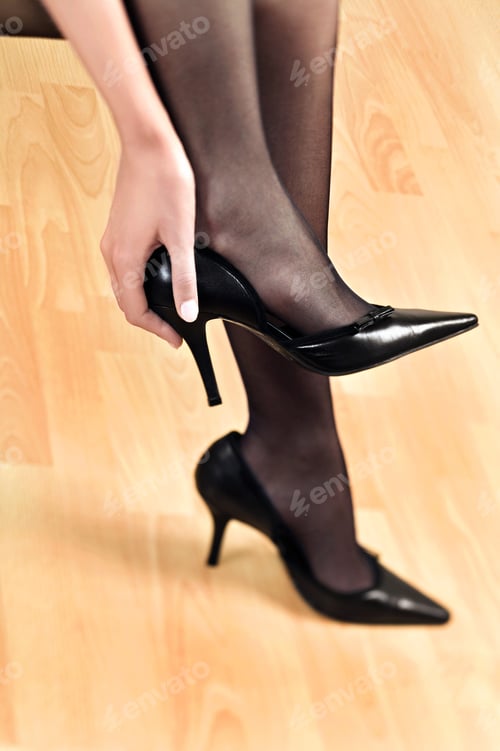 Preview: Close Up Of Woman Putting On High Heels