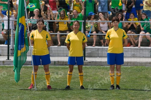 Preview: Group Of Female Soccer Players With Brazilian Flag Standing On Field