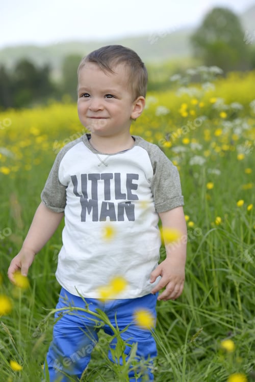 Preview: Baby Boy Standing In Meadow
